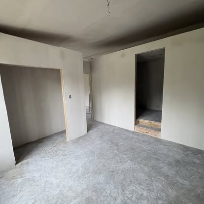 Finished interior room with drywall complete
